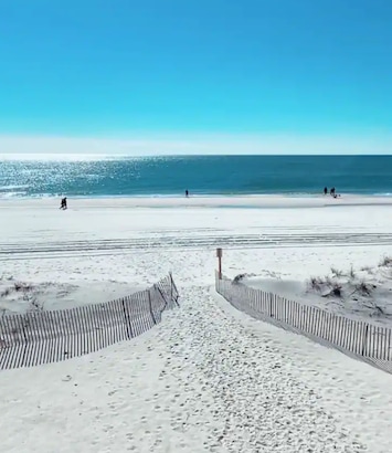 Beautiful sandy beaches just steps away. Private beach entrance. 