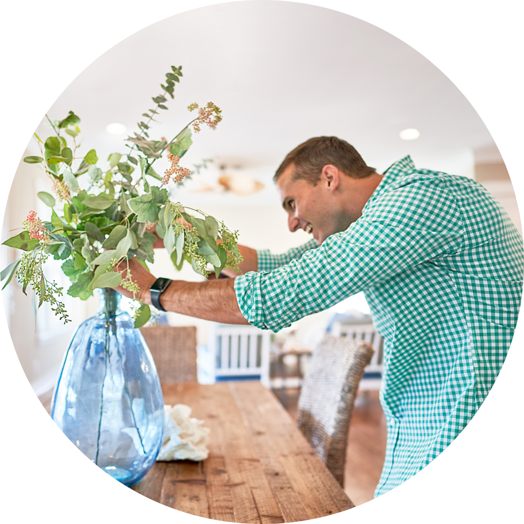 Vrbo host arranging flowers
